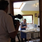 Chris is preparing the buns for the Community