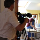 Julian fils Steven as he is about to take the tray to the oven